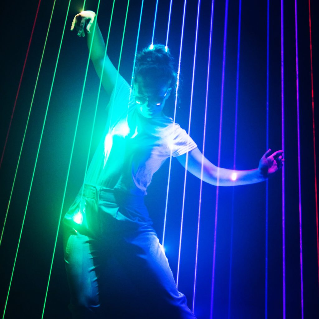 Hannah dancing in laser beams